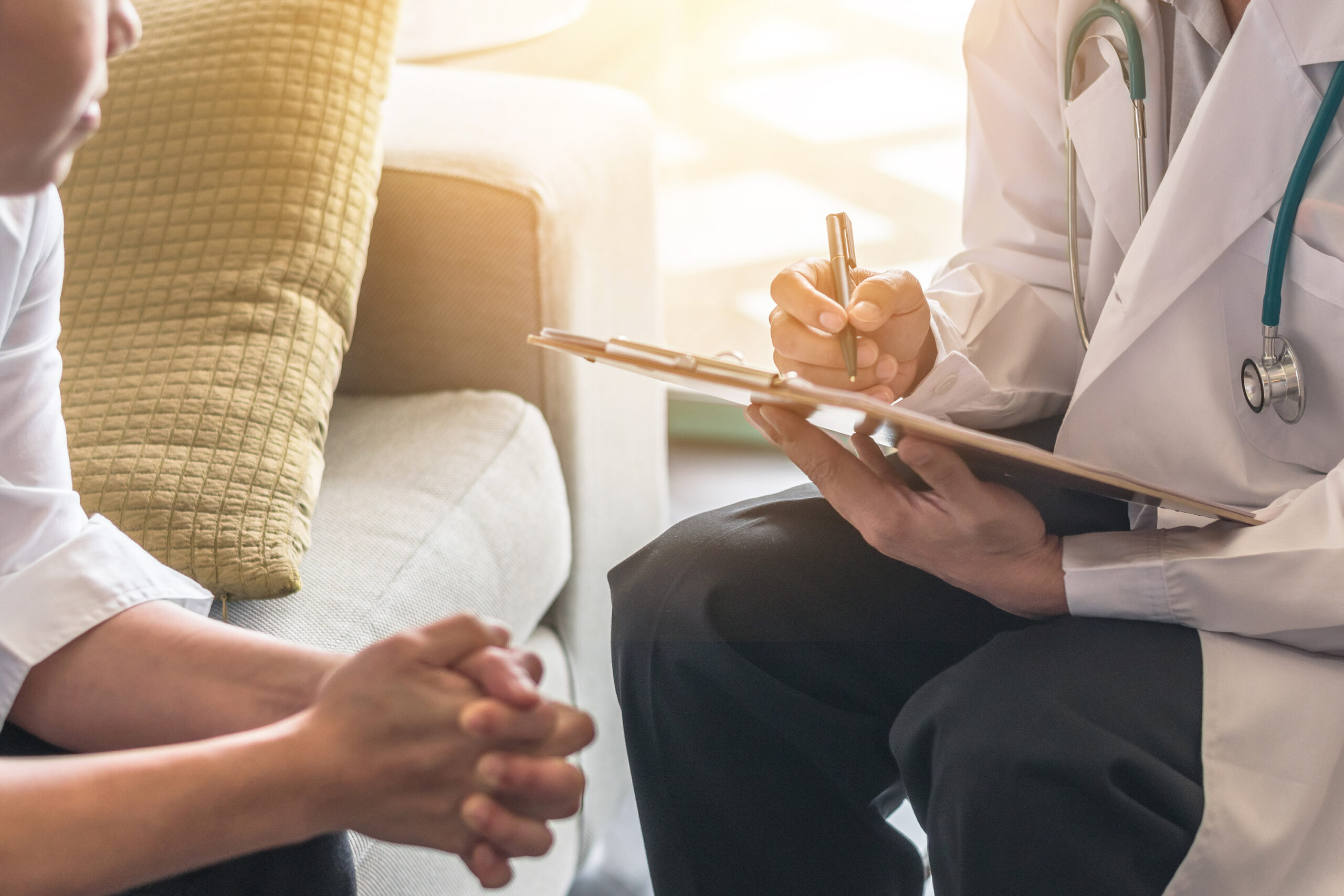 Woman patient having consultation with doctor (gynecologist or psychiatrist) and examining  health in medical gynecological clinic or hospital mental health service center